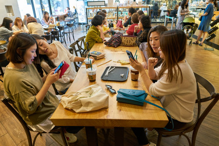 BUSAN, SOUTH KOREA - CIRCA MAY, 2017: inside Starbucks coffee shop in Busan. Starbucks Corporation is an American coffee company and coffeehouse chain.のeditorial素材