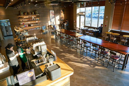 BUSAN, SOUTH KOREA - CIRCA MAY, 2017: inside Starbucks coffee shop in Busan. Starbucks Corporation is an American coffee company and coffeehouse chain.のeditorial素材