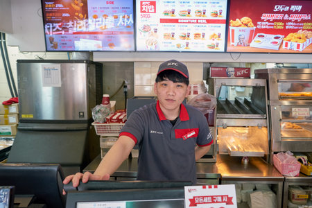 SEOUL, SOUTH KOREA - CIRCA MAY, 2017: indoor portrait of staff at KFC fast food restaurant. KFC  is...