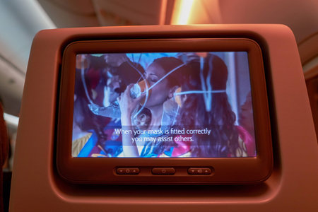 INCHEON, SOUTH KOREA - CIRCA JUNE, 2017: close up shot of a seat-back screen inside the cabin of Qatar Airways Boeing 777. Qatar Airways, is the state-owned flag carrier of Qatar.のeditorial素材