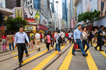 HONG KONG - CIRCA NOVEMBER, 2016: crowd of people walking crossing road in Hong Kong.のeditorial素材