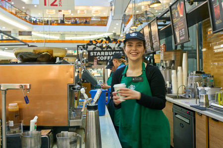 SAINT PETERSBURG, RUSSIA - CIRCA AUGUST, 2017: indoor portrait of staff at Starbucks coffee shop in Saint Petersburg. Starbucks Corporation is an American coffee company and coffeehouse chain.のeditorial素材