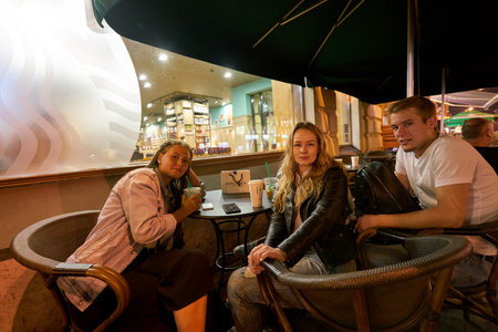 SAINT PETERSBURG, RUSSIA - CIRCA AUGUST, 2017: people at Starbucks coffee shop in Saint Petersburg. Starbucks Corporation is an American coffee company and coffeehouse chain.のeditorial素材