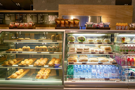 DOHA, QATAR - CIRCA MAY, 2017: food, snacks and beverages on display at Hamad International Airport of Doha.のeditorial素材