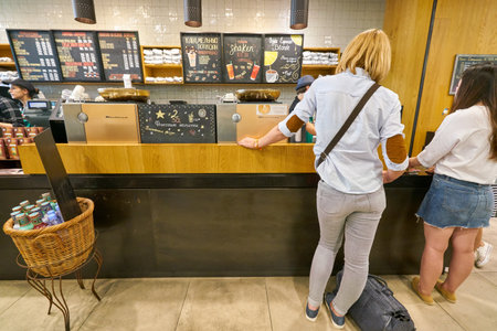 SAINT PETERSBURG, RUSSIA - CIRCA AUGUST, 2017: inside Starbucks coffee shop. Starbucks Corporation is an American coffee company and coffeehouse chain.のeditorial素材