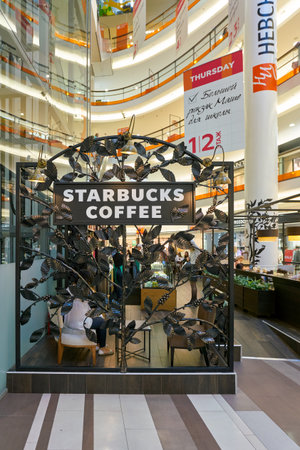 SAINT PETERSBURG, RUSSIA - CIRCA AUGUST, 2017: Starbucks coffee shop at a shopping center in Saint Petersburg. Starbucks Corporation is an American coffee company and coffeehouse chain.のeditorial素材