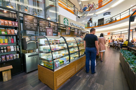 SAINT PETERSBURG, RUSSIA - CIRCA AUGUST, 2017: Starbucks coffee shop at a shopping center in Saint Petersburg. Starbucks Corporation is an American coffee company and coffeehouse chain.のeditorial素材