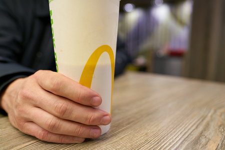 SAINT PETERSBURG, RUSSIA - CIRCA OCTOBER, 2017: close up shot of a cup at a McDonald's restaurant in Saint Petersburg. McDonald's is an American hamburger and fast food restaurant chain.のeditorial素材