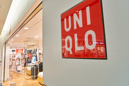 BUSAN, SOUTH KOREA - MAY 25, 2017: close up shot of a Uniqlo sign at Lotte Mall in Busan. Uniqlo Co., Ltd. is a Japanese casual wear designer, manufacturer and retailer.のeditorial素材