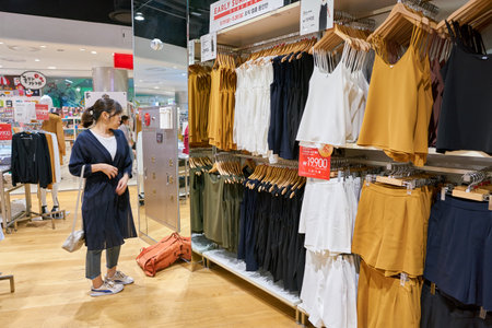 BUSAN, SOUTH KOREA - MAY 28, 2017: inside Uniqlo store at Lotte Department Store in Busan. Uniqlo Co., Ltd. is a Japanese casual wear designer, manufacturer and retailer.のeditorial素材