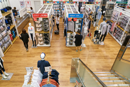 BUSAN, SOUTH KOREA - MAY 25, 2017: inside a Uniqlo store at Lotte Mall in Busan. Uniqlo Co., Ltd. is a Japanese casual wear designer, manufacturer and retailer.のeditorial素材