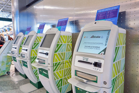 MILAN MALPENSA, ITALY - CIRCA NOVEMBER, 2017: Alitalia self service check-in kiosks at...