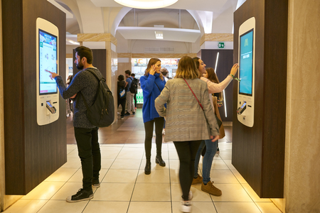 ROME, ITALY - CIRCA NOVEMBER, 2017: customers use self-ordering kiosks at McDonald's restaurant in Rome.のeditorial素材