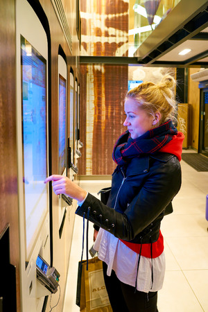 MILAN, ITALY - CIRCA NOVEMBER, 2017: customer at a McDonald's store place orders and pay through self ordering kiosk.のeditorial素材