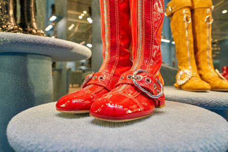 MILAN, ITALY - CIRCA NOVEMBER, 2017: boots on display at Miu Miu shop in Milan. Miu Miu is an Italian high fashion women's clothing and accessory brand.のeditorial素材