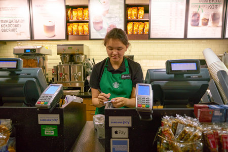 SAINT PETERSBURG, RUSSIA - CIRCA MAY, 2018: staff at Starbucks Coffee in Pulkovo Airport.のeditorial素材