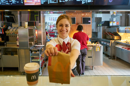 MOSCOW, RUSSIA - CIRCA MAY, 2018: worker at McDonald's. McDonald's is an American hamburger and fast...