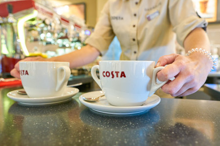 NIZHNY NOVGOROD, RUSSIA - CIRCA JULY, 2018: barista at Costa Coffee in Strigino International...