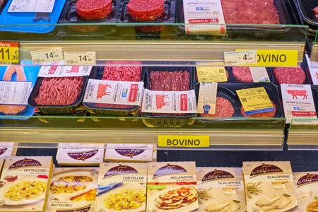 MILAN, ITALY - CIRCA NOVEMBER, 2017: assortment of meat products on display for sale at Carrefour Express in Milan.のeditorial素材