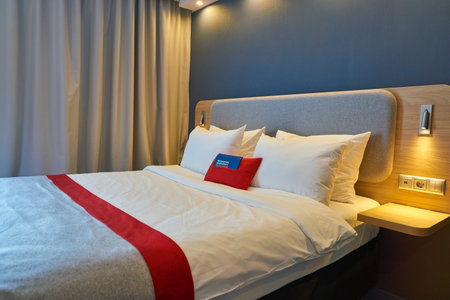 MOSCOW, RUSSIA - CIRCA AUGUST, 2018: interior shot of a hotel room in Holiday Inn Express. Holiday Inn Express is a mid-priced hotel chain within the InterContinental Hotels Group family of brands.のeditorial素材