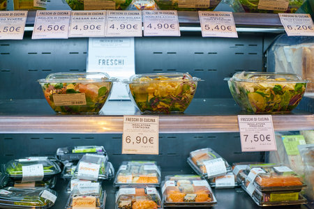 MILAN, ITALY - CIRCA NOVEMBER, 2017: assortment of food on display for sale at Carrefour Express in Milan.のeditorial素材