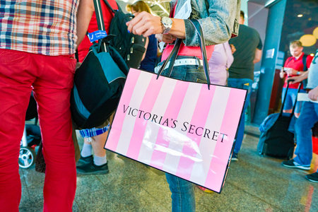 MOSCOW, RUSSIA - CIRCA AUGUST, 2018:  a woman stand with Victoria's secret branded shopping bag in...