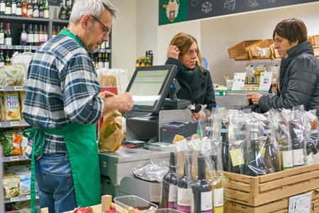 MILAN, ITALY - CIRCA NOVEMBER, 2017: cashier and sustomers at Bio c'Bon shop in Milan.のeditorial素材