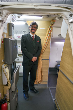 ROME, ITALY - CIRCA NOVEMBER, 2017: Alitalia crew member on board of Alitalia Embraer 175のeditorial素材