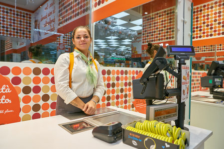 MILAN, ITALY - CIRCA NOVEMBER, 2017: indoor portrait of a worker at OD Store confectionery outlet in Milan.のeditorial素材