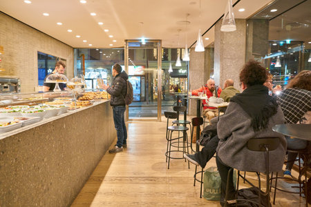 MILAN, ITALY - CIRCA NOVEMBER, 2017: interior shot of Farini in Milan. Farini is modern bakery which offers Italian pastry, salads, bowls and pizzaのeditorial素材