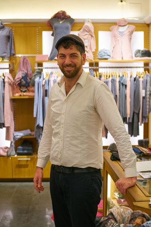 ROME, ITALY - CIRCA NOVEMBER, 2017: indoor portrait of man at a store in Rome.のeditorial素材