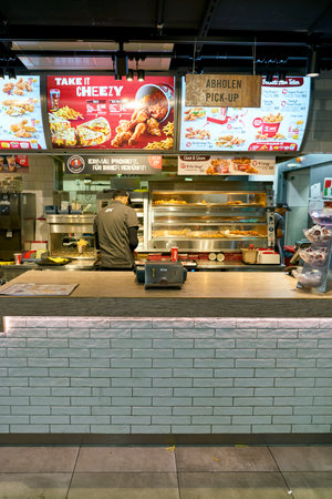 DUSSELDORF, GERMANY - CIRCA OCTOBER, 2018: KFC restaurant in Dusseldorf airport. KFC is an American fast food restaurant chain that specializes in fried chicken.のeditorial素材