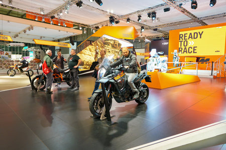 MILAN, ITALY - NOVEMBER 11, 2017: visitors try out a motorcycle at the EICMA 2017 - 75th...