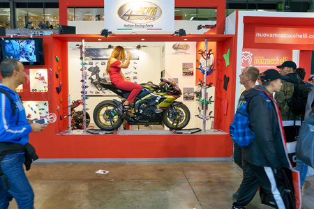 MILAN, ITALY - NOVEMBER 11, 2017: a model poses for the visitors during the EICMA 2017 - 75th...