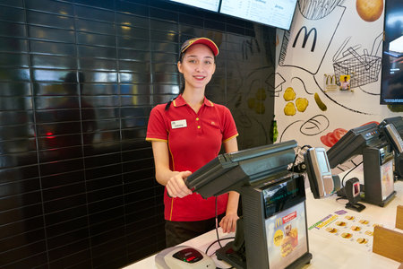 KALININGRAD, RUSSIA - CIRCA SEPTEMBER, 2018: worker in McDonald's restaurant. McDonald's is an...
