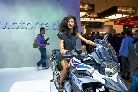 MILAN, ITALY - NOVEMBER 11, 2017: a model poses for the visitors during the EICMA 2017 - 75th...