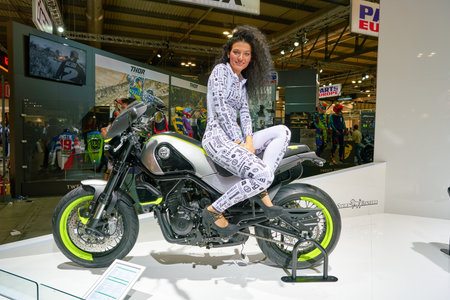 MILAN, ITALY - NOVEMBER 11, 2017: a model poses for the visitors during the EICMA 2017 - 75th...