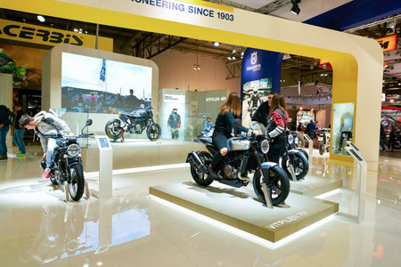 MILAN, ITALY - NOVEMBER 11, 2017: visitors try out a motorcycle at the EICMA 2017 - 75th...