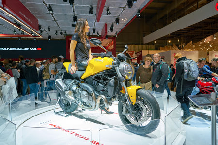 MILAN, ITALY - NOVEMBER 11, 2017: a model poses for the visitors during the EICMA 2017 - 75th International Motorcycle Exhibition.のeditorial素材