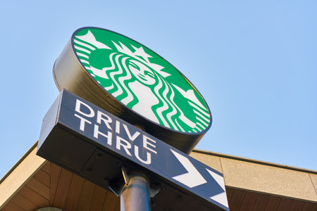 BUSAN, SOUTH KOREA - CIRCA MAY, 2017: drive-thru sign at Starbucks coffee shop in Busan. Starbucks Corporation is an American coffee company and coffeehouse chain.のeditorial素材
