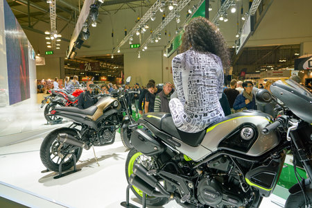 MILAN, ITALY - NOVEMBER 11, 2017: a model poses for the visitors during the EICMA 2017 - 75th...