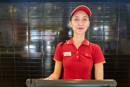 KALININGRAD, RUSSIA - CIRCA SEPTEMBER, 2018: worker in McDonald's restaurant. McDonald's is an...