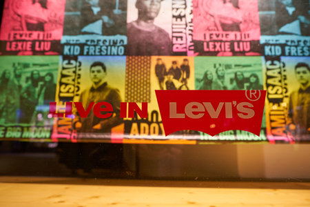 DUSSELDORF, GERMANY - CIRCA SEPTEMBER, 2018: close up shot of Levi's sign on a shop window at Levi's...