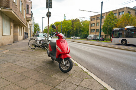 DUSSELDORF, GERMANY - CIRCA SEPTEMBER, 2018: red scooter parked in Dusseldorf.のeditorial素材