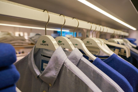 DUSSELDORF, GERMANY - CIRCA SEPTEMBER, 2018: Lacoste sign on clothes hanger at Lacoste shop in...