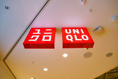 MOSCOW, RUSSIA - CIRCA SEPTEMBER, 2018: Uniqlo sign at store in Moscow. Uniqlo Co. Ltd is a Japanese casual wear designer, manufacturer and retailerのeditorial素材