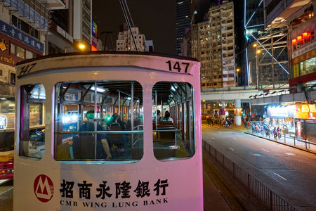 HONG KONG, CHINA - CIRCA JANUARY, 2019: close up shot of a typical HKT double-decker tram in Hong Kong at night.のeditorial素材