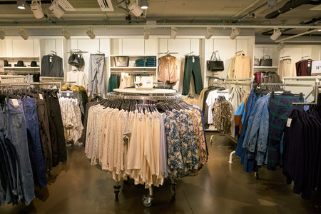 ZURICH, SWITZERLAND - CIRCA OCTOBER, 2018: apparel on display at H&M store in Zurich International Airport.のeditorial素材