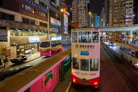 HONG KONG, CHINA - CIRCA JANUARY, 2019: a typical HKT double-decker tram in Hong Kong at night.のeditorial素材