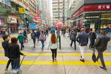 HONG KONG, CHINA - CIRCA JANUARY, 2019: diverse people crossing street in Hong Kong.のeditorial素材